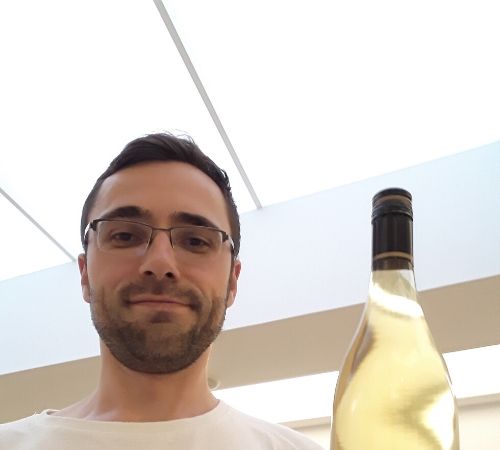 Nicolas Foullireoux with a wine bottle